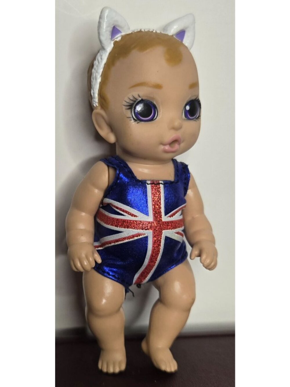 Zapf Creations Baby Born Mini Surprise Doll With Union Jack Swimsuit